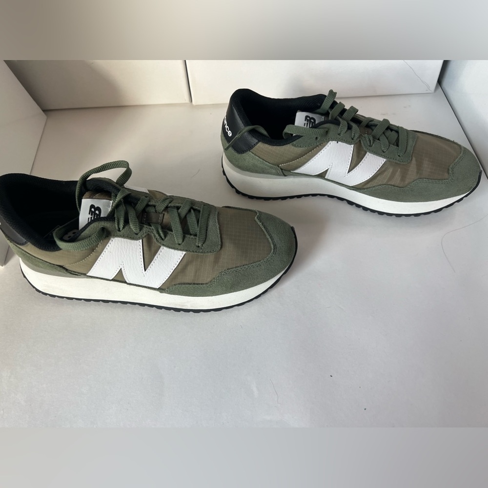 Brand new, New Balance shoes. These are un-worn sneakers